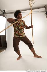 Man Adult Average Black Fighting with spear Standing poses Coat